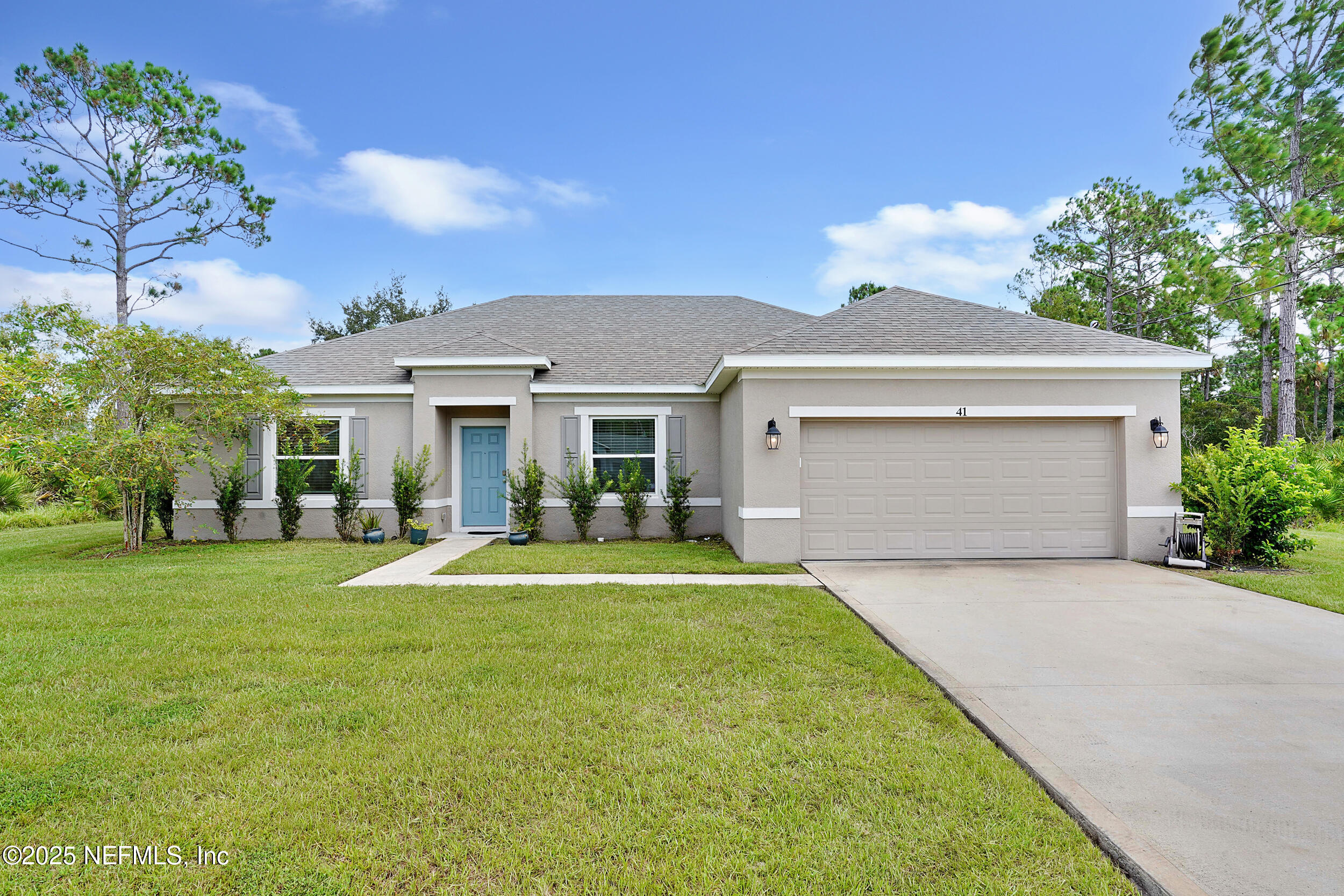 41 Seathorn Path Palm Coast, FL 32164 - Photo 1 of 48 front view of a house with a yard