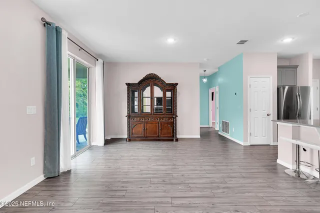 a view of livingroom with furniture and wooden floor