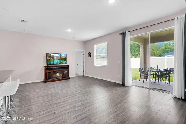 a view of kitchen with microwave and cabinets