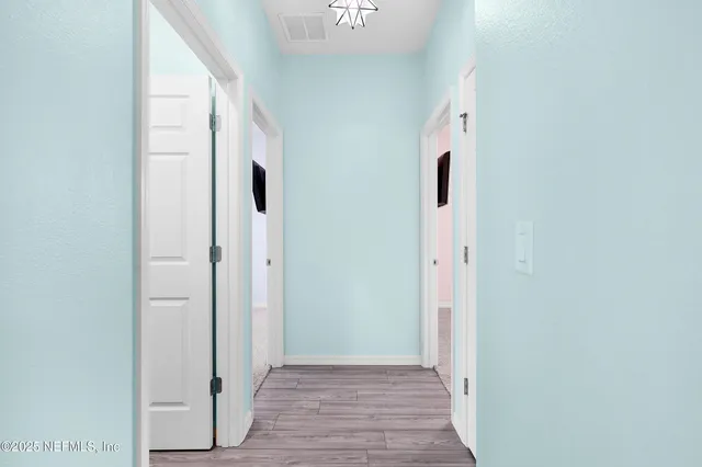 a bathroom with a granite countertop toilet a sink and a shower
