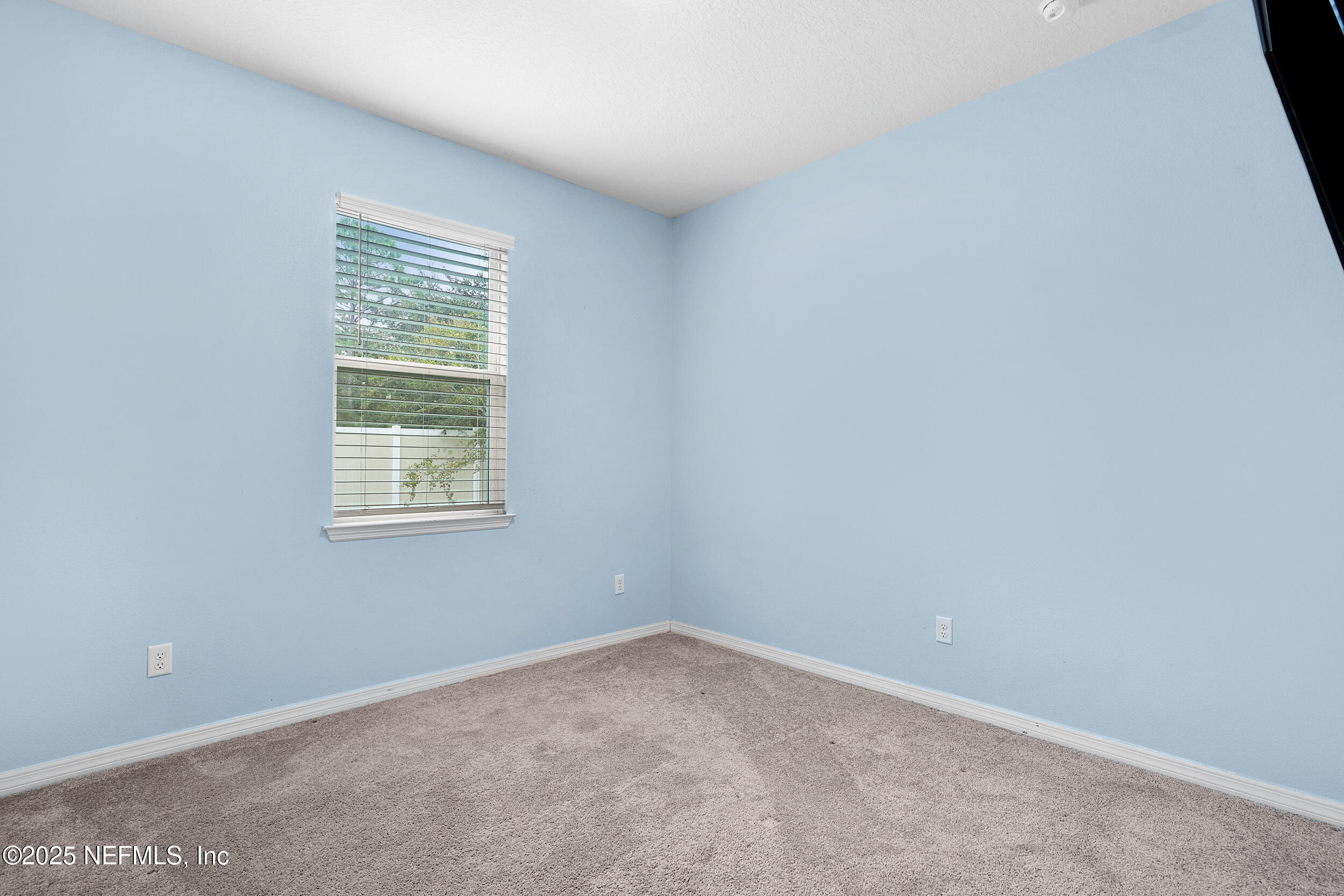 41 Seathorn Path Palm Coast, FL 32164 - Photo 20 of 48 an empty room with a window