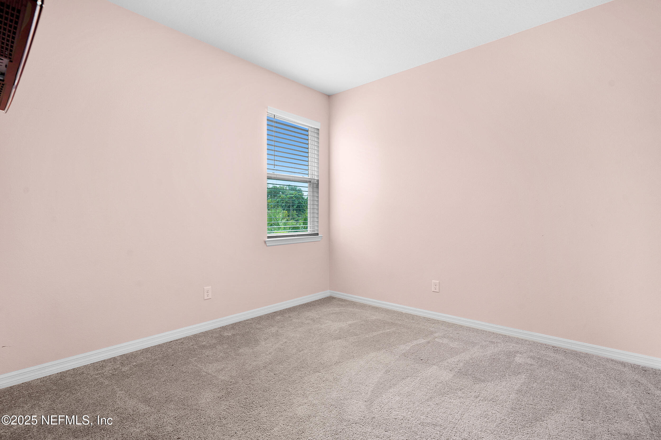 41 Seathorn Path Palm Coast, FL 32164 - Photo 22 of 48 an empty room with a window
