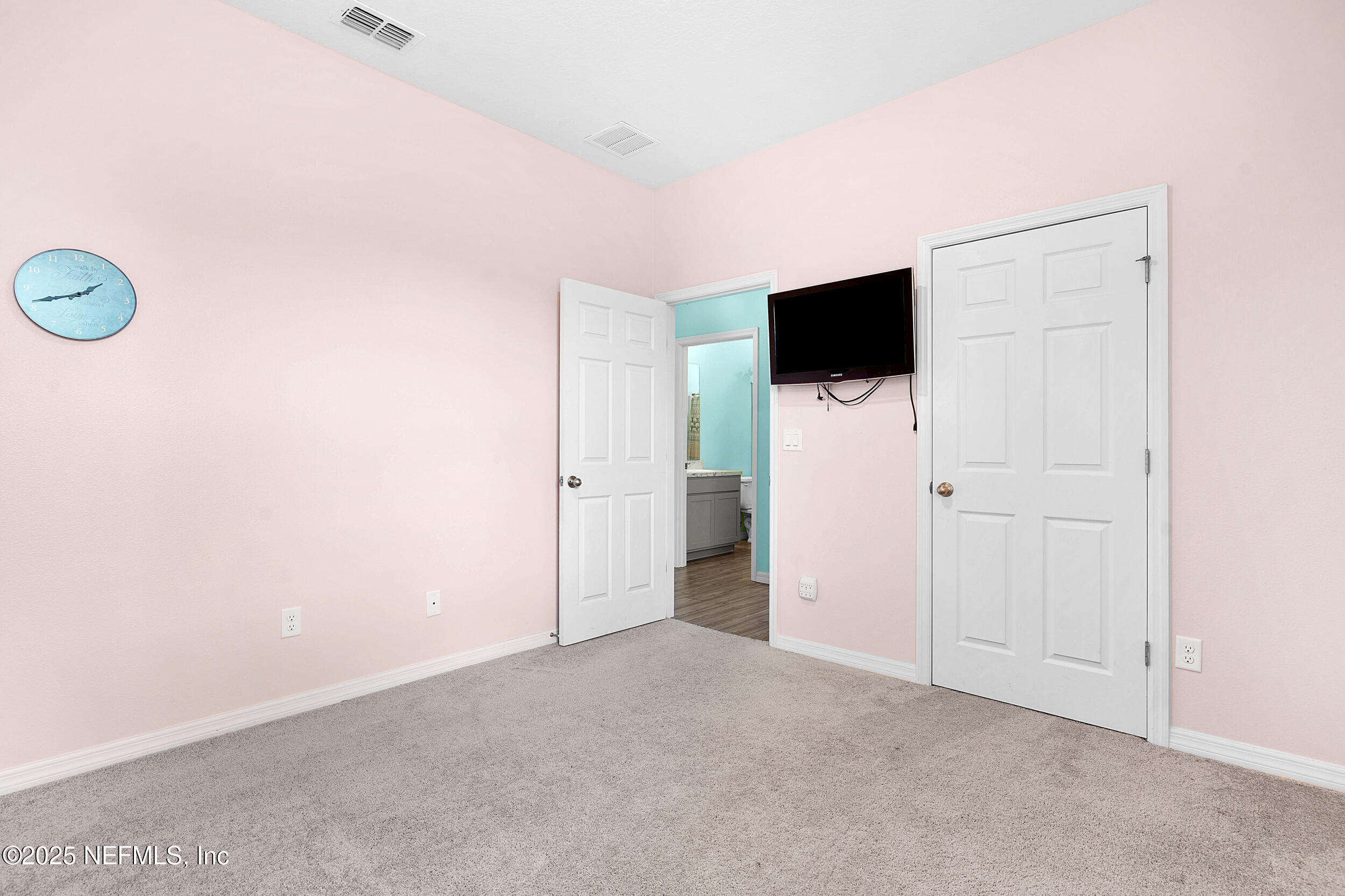 41 Seathorn Path Palm Coast, FL 32164 - Photo 23 of 48 a view of a livingroom with a flat screen tv