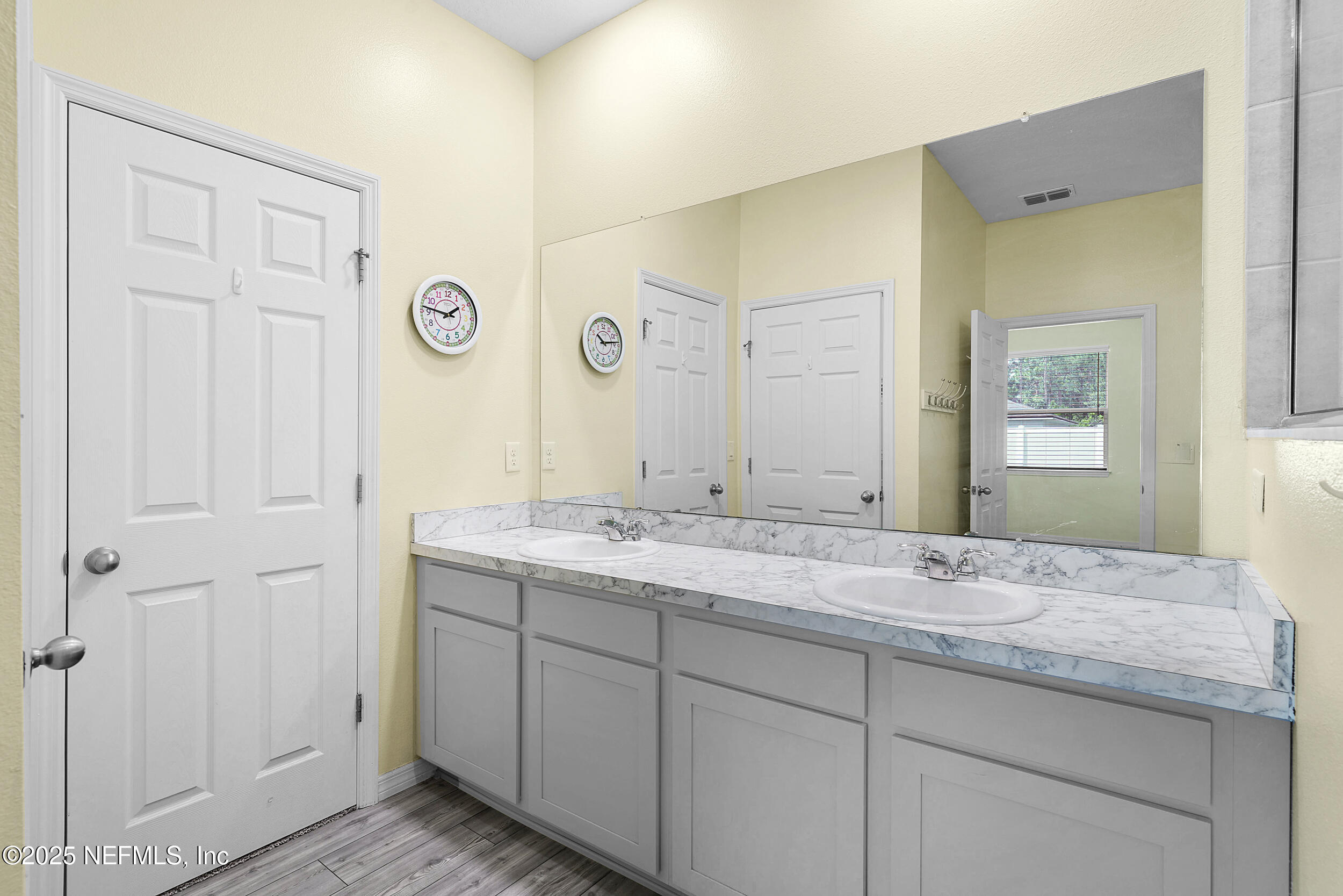 41 Seathorn Path Palm Coast, FL 32164 - Photo 27 of 48 a bathroom with a granite countertop sink and a mirror