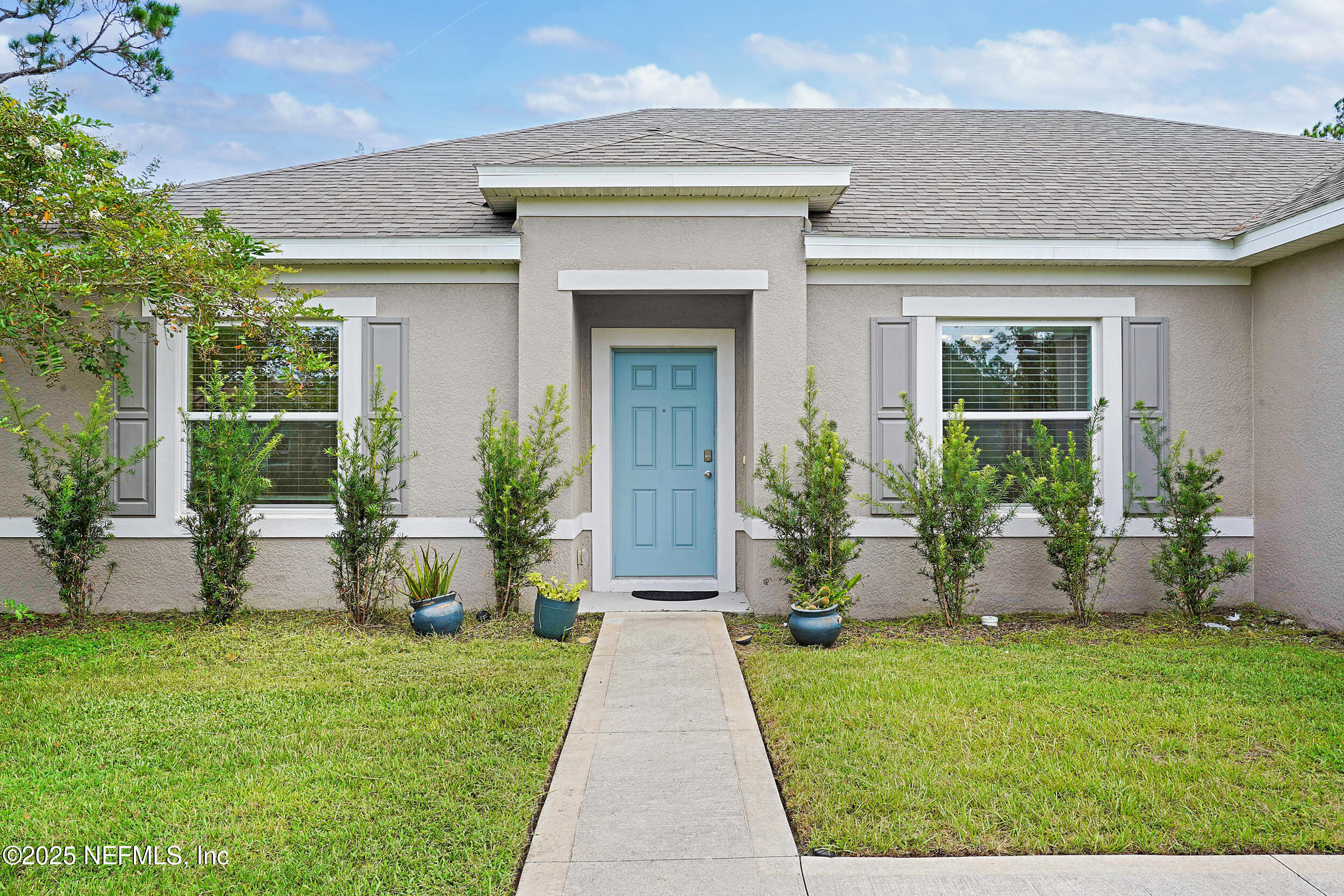 41 Seathorn Path Palm Coast, FL 32164 - Photo 3 of 48 a front view of house with yard