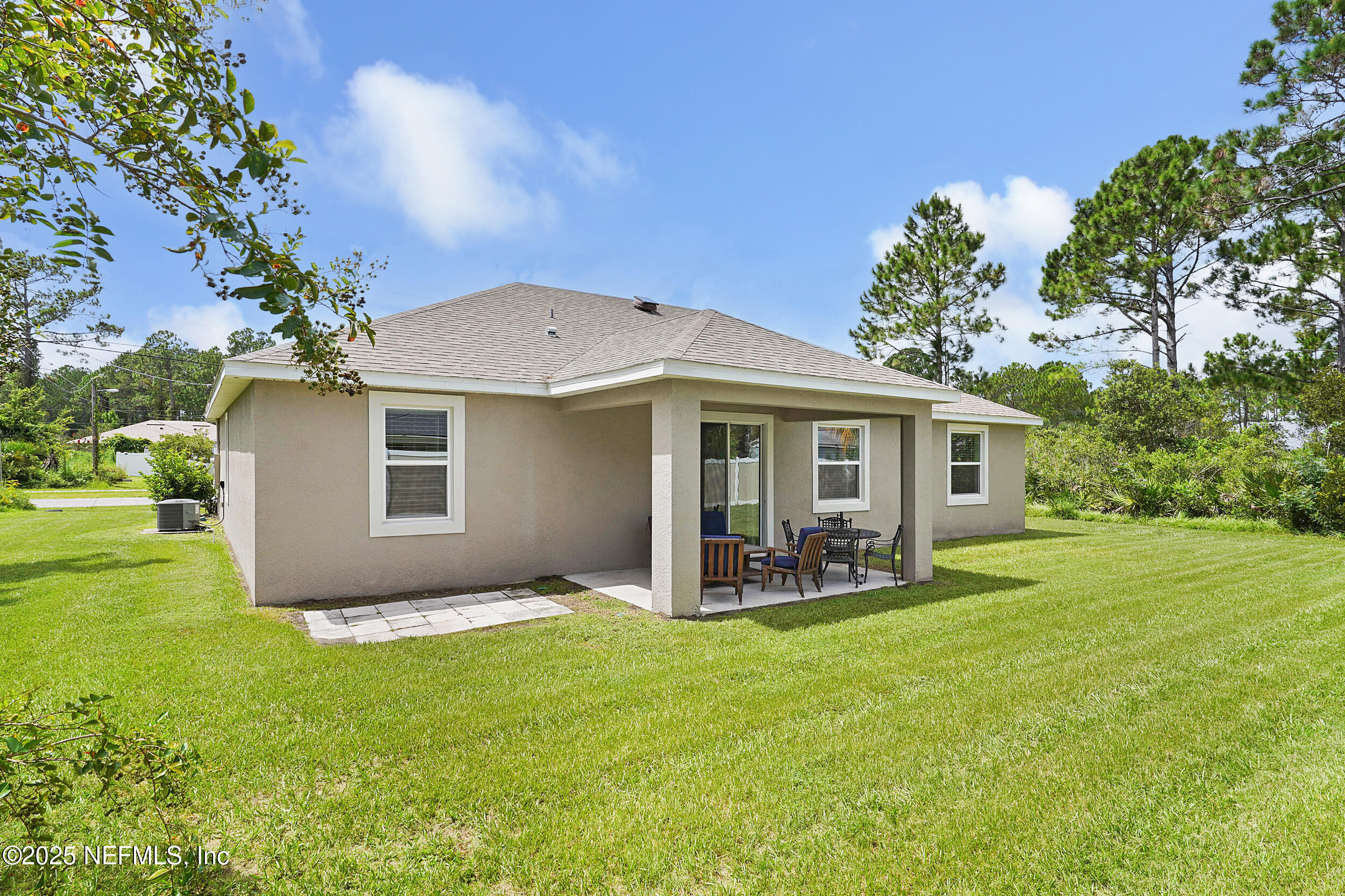 41 Seathorn Path Palm Coast, FL 32164 - Photo 34 of 48 a front view of house with yard and green space