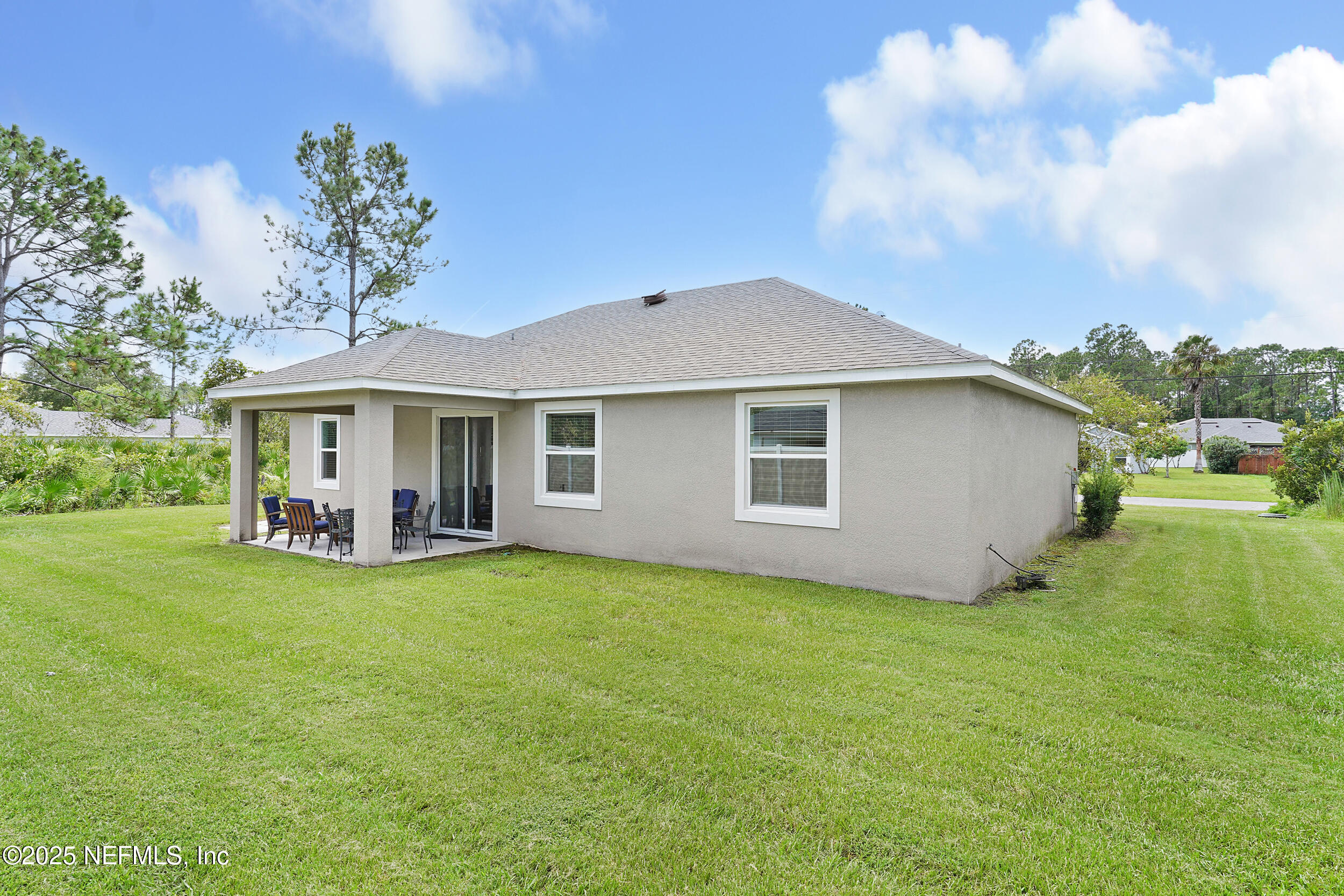 41 Seathorn Path Palm Coast, FL 32164 - Photo 36 of 48 a view of a house with a yard and sitting area