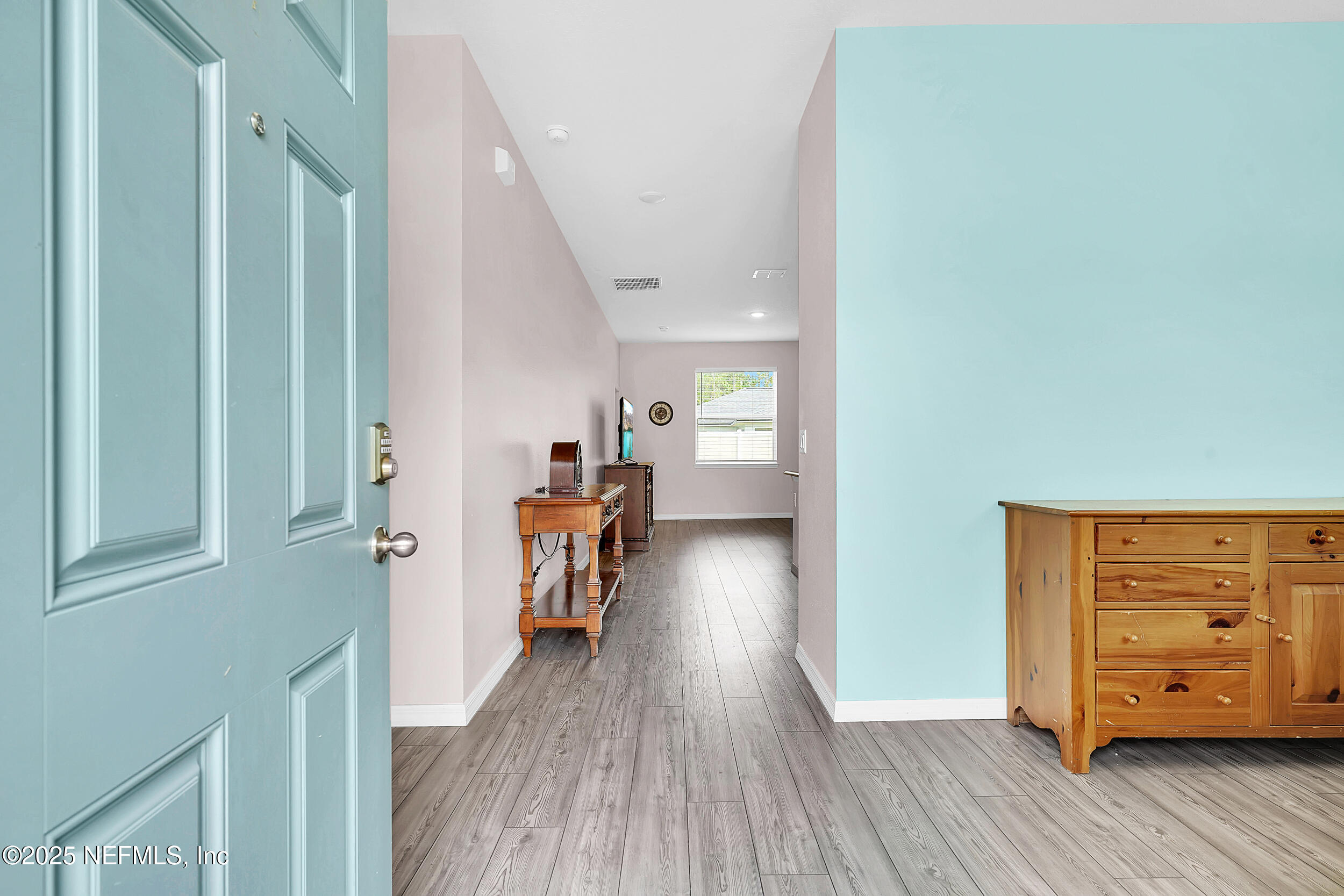 41 Seathorn Path Palm Coast, FL 32164 - Photo 4 of 48 a view of a hallway to a livingroom with furniture