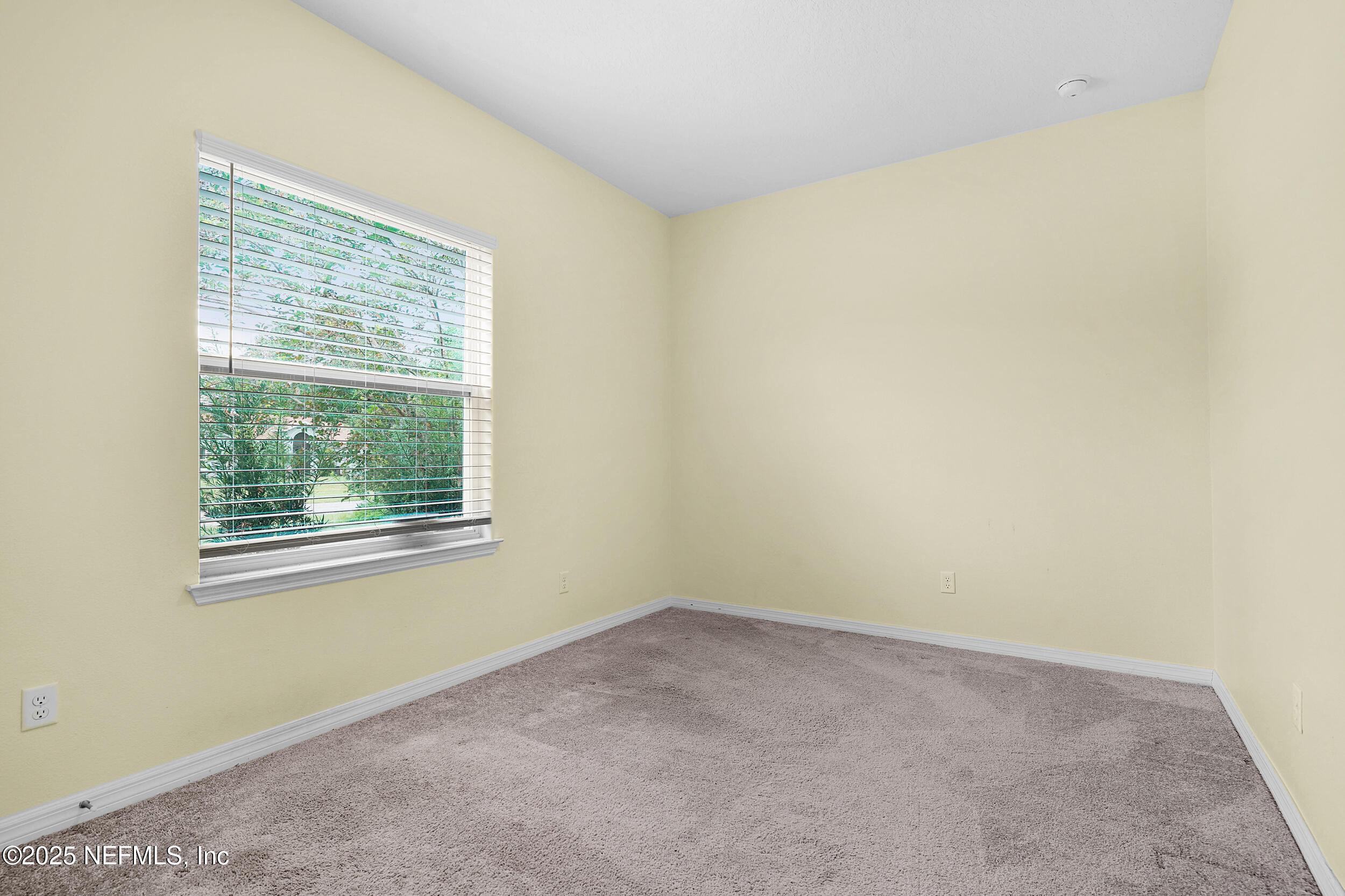 41 Seathorn Path Palm Coast, FL 32164 - Photo 7 of 48 an empty room with a window