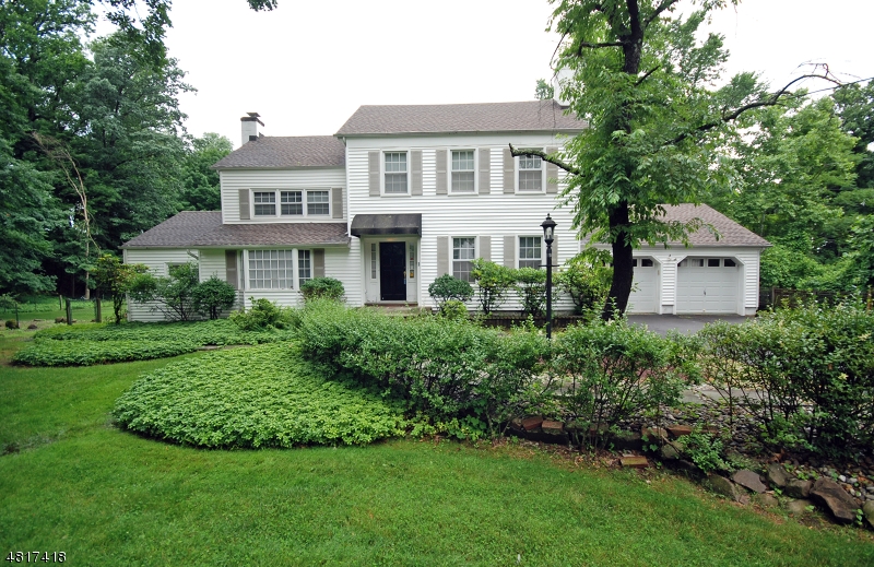 1 Old Mill Road Fairfield, NJ 07004 - Photo 1 of 14 a view of a house with a yard and plants