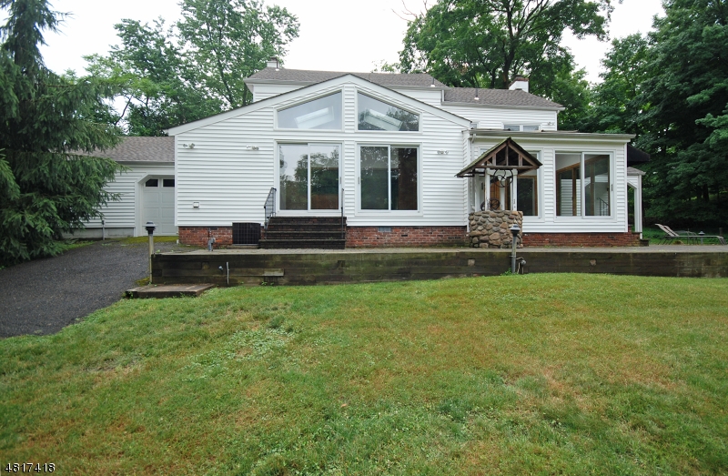 1 Old Mill Road Fairfield, NJ 07004 - Photo 12 of 14 a front view of a house with a yard