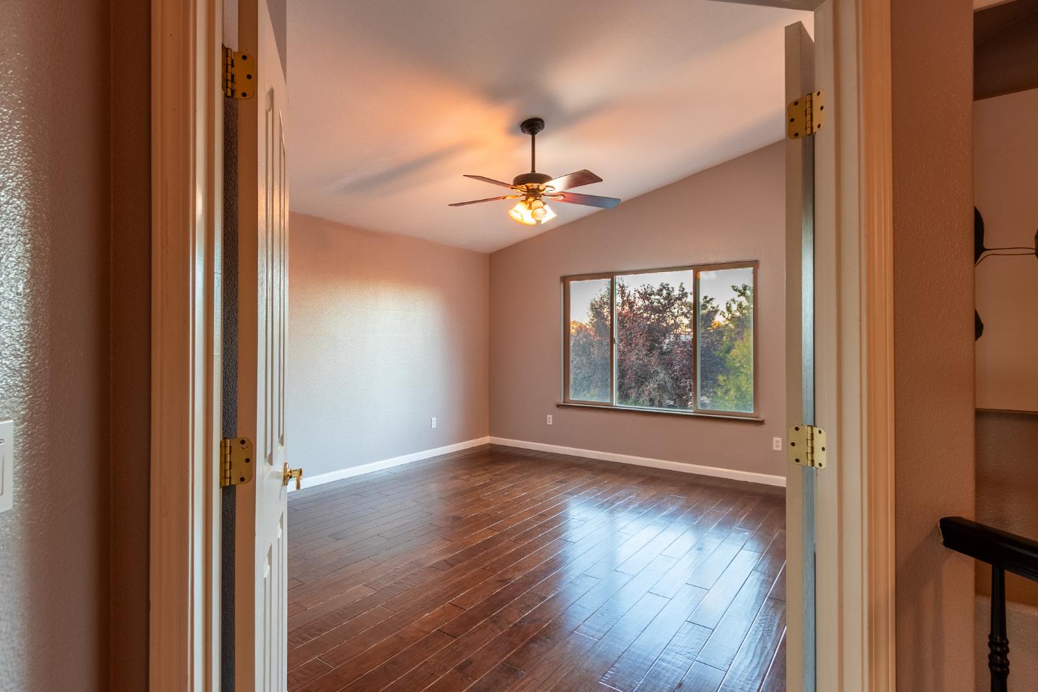 2024 Archer Circle Rocklin, CA 95765 - Photo 17 of 52 a view of an empty room with a window and wooden floor