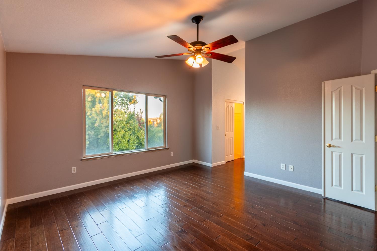 2024 Archer Circle Rocklin, CA 95765 - Photo 18 of 52 a view of an empty room with wooden floor and a window