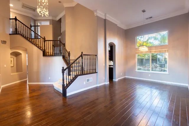 a view of an entryway with wooden floor