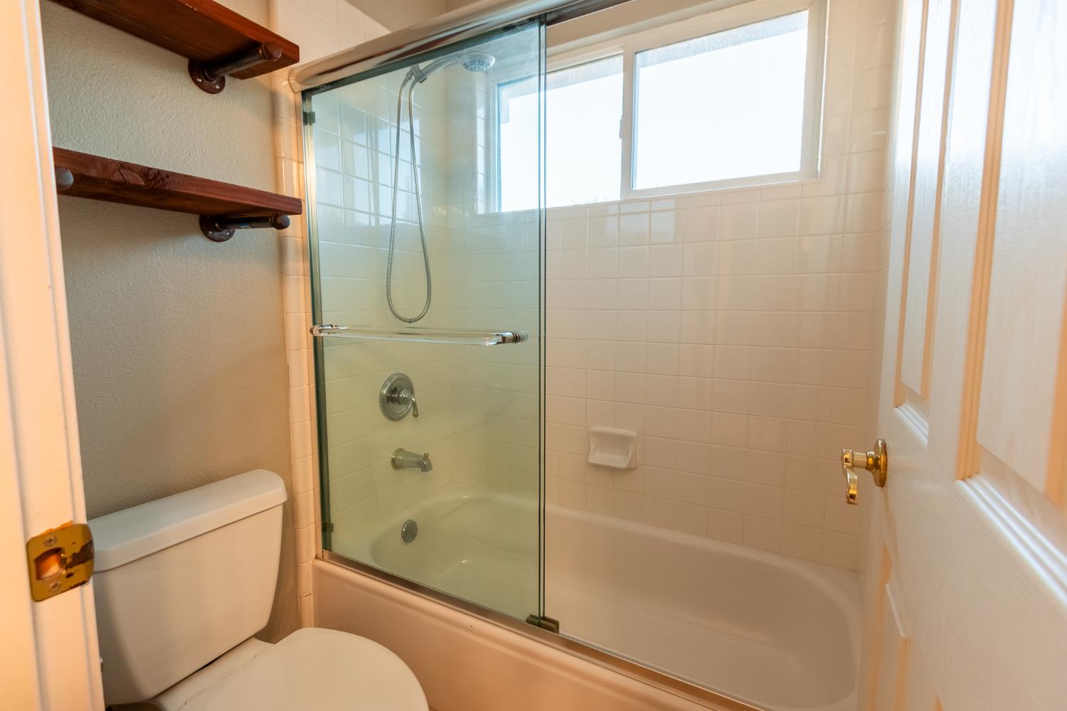 2024 Archer Circle Rocklin, CA 95765 - Photo 30 of 52 a bathroom with a shower and a toilet