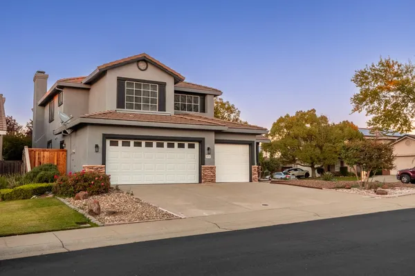 a front view of a house with a garage