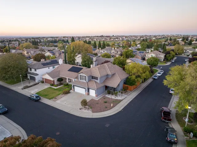 an aerial view of a house with a garden