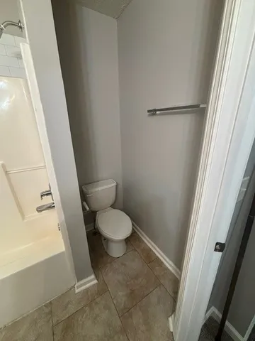 a view of an empty room with a fan