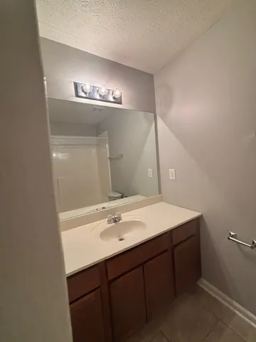 a front view of a house with a wooden fence