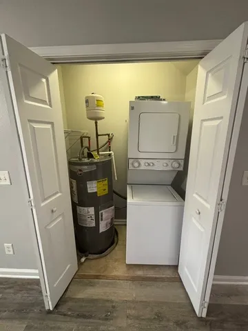 a view of storage and utility room with closet