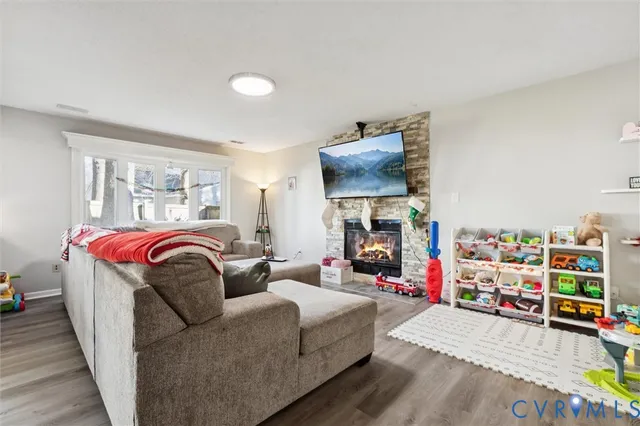 a bedroom with furniture and a flat screen tv