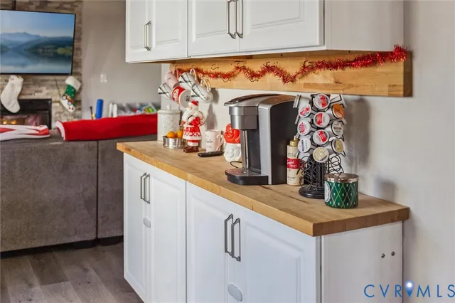 a kitchen with stainless steel appliances granite countertop a sink and a refrigerator