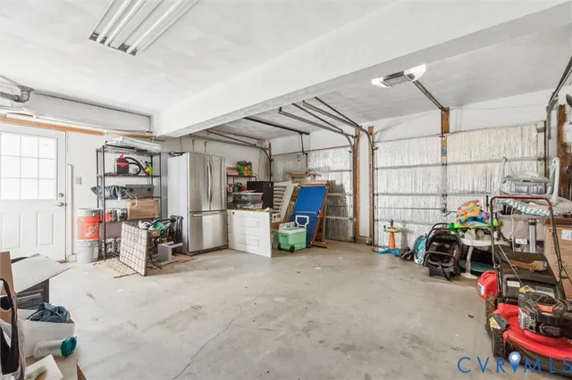 a couple of table and chairs in front of house