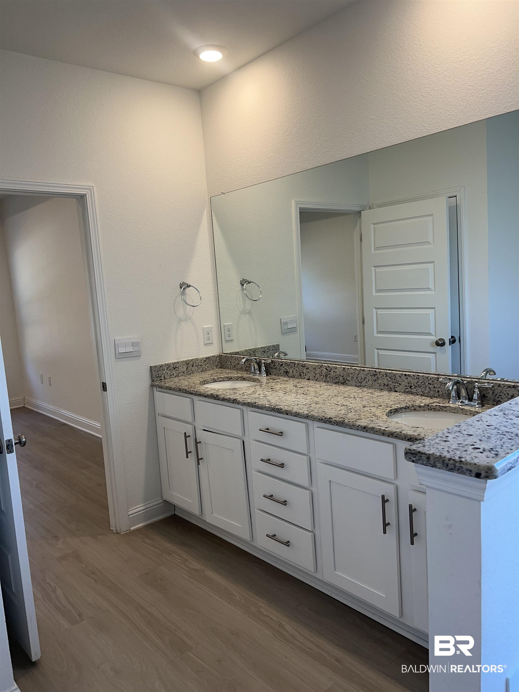 8855 Calverton Street Foley, AL 36535 - Photo 55 of 76 Bathroom with vanity and wood-type flooring