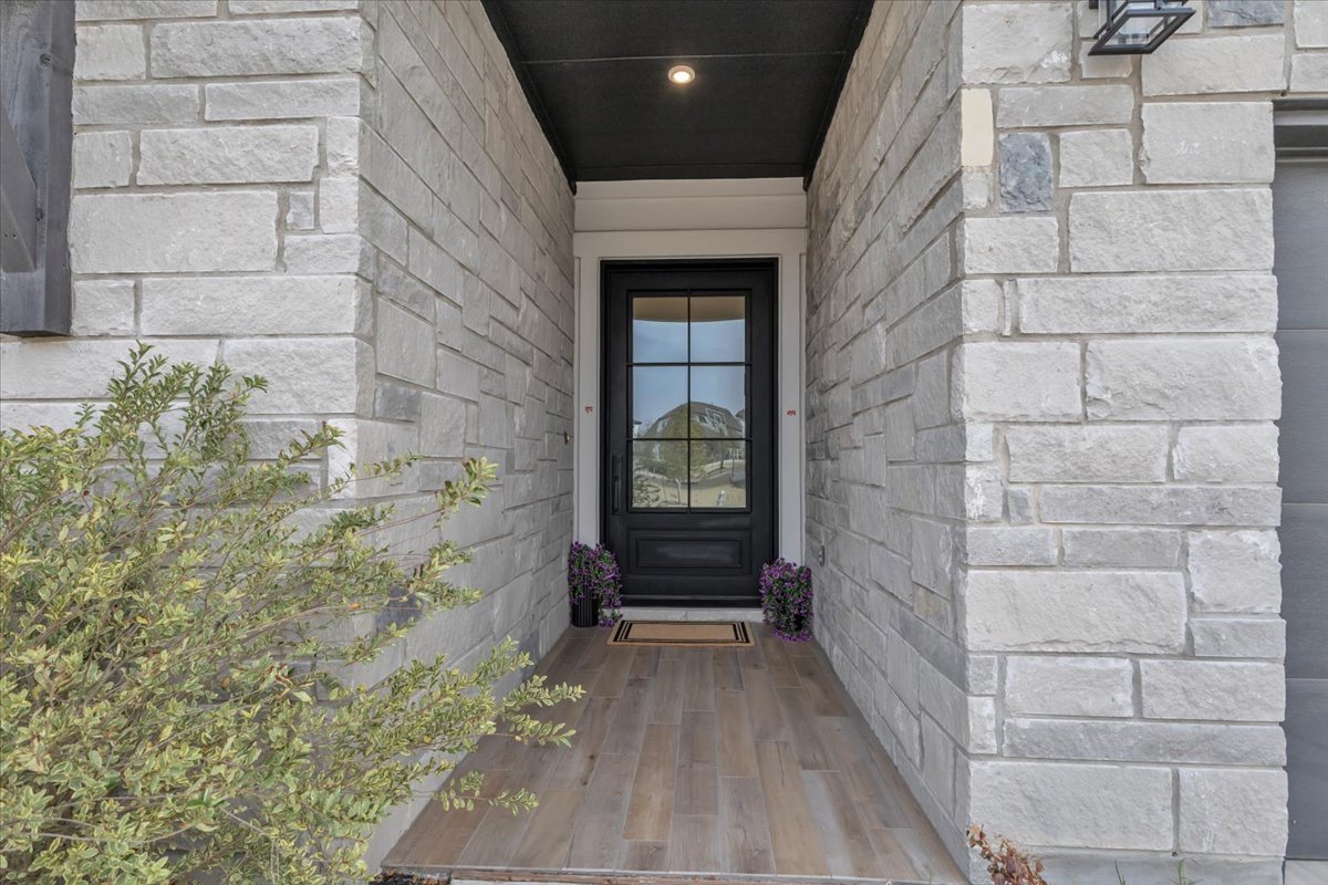 2312 Mondello Path Leander, TX 78641 - Photo 5 of 40 View of exterior entry with stone siding
