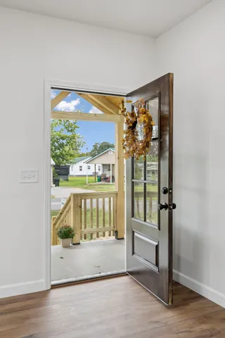 a kitchen with refrigerator and cabinets