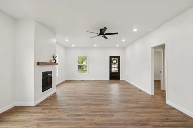 a kitchen with stainless steel appliances granite countertop a sink a stove top oven a counter space and cabinets