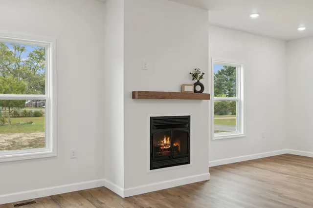 a kitchen with stainless steel appliances granite countertop a sink a stove and a microwave