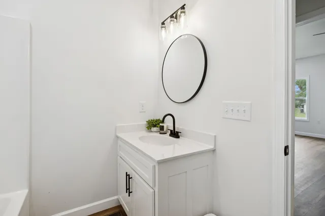 a view of swimming pool with yard from a balcony