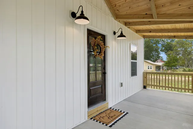 a front view of a house with a porch