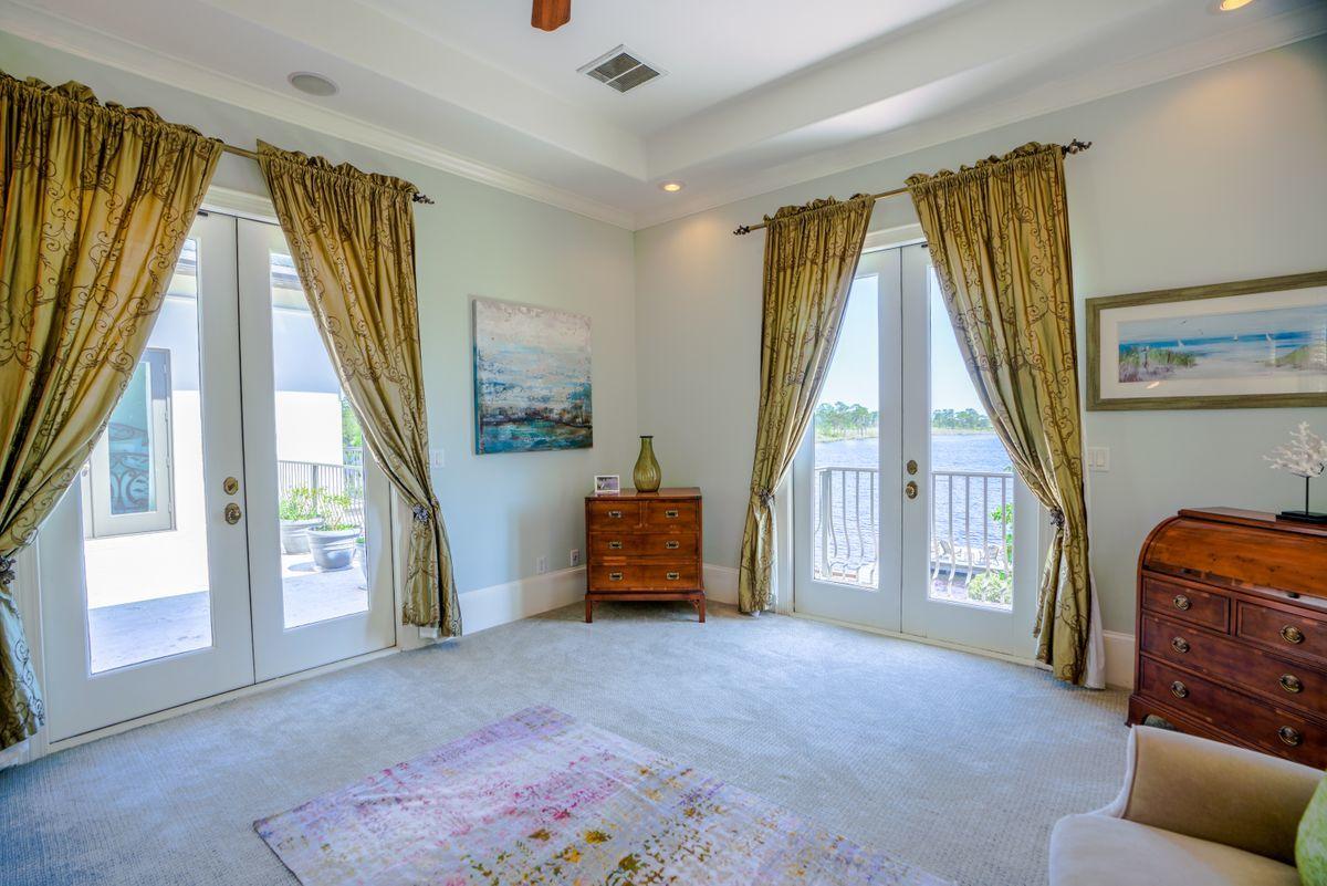 227 Wilderness Way Santa Rosa Beach, FL 32459 - Photo 24 of 45 a living room with furniture and a flat screen tv