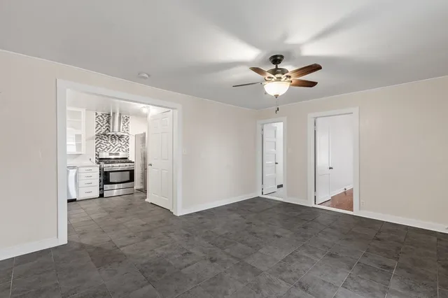a view of a livingroom with a kitchen space a sink and dishwasher