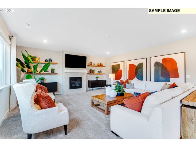 a living room with fireplace furniture and a flat screen tv