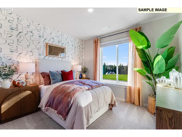 a bedroom with bed and a potted plant