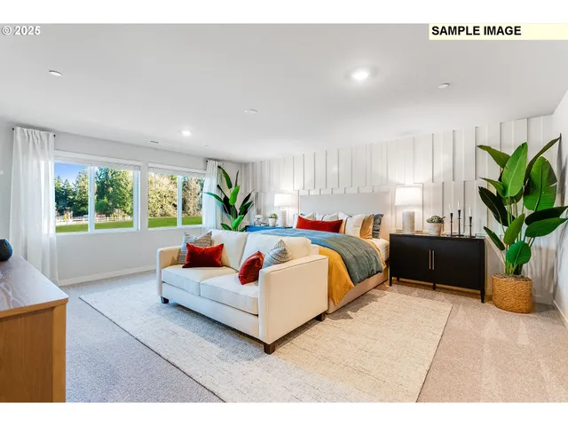 a spacious bedroom with a bed and a couch