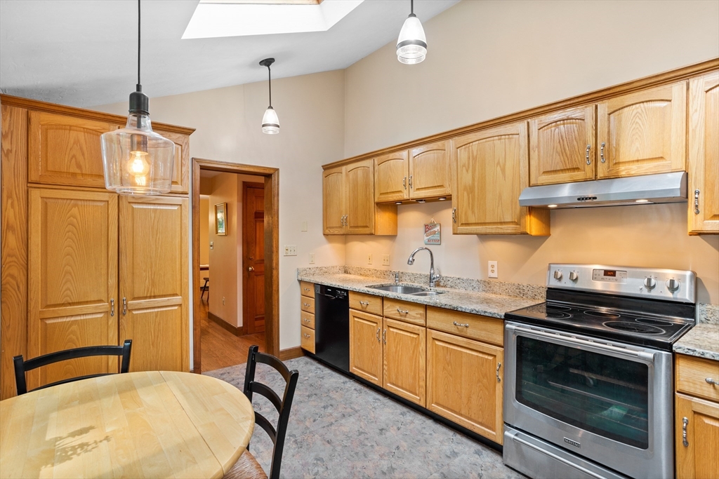 773 Great Road Stow, MA 01775 - Photo 14 of 37 a kitchen with stainless steel appliances a stove a refrigerator and cabinets