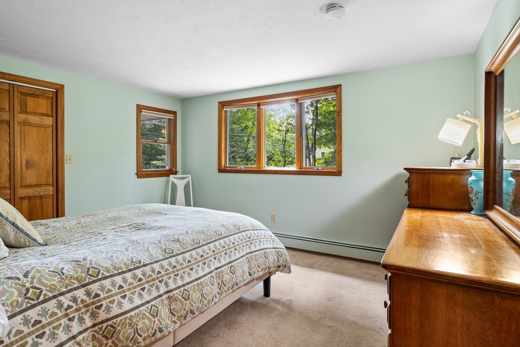 773 Great Road Stow, MA 01775 - Photo 17 of 37 a bedroom with a bed and window