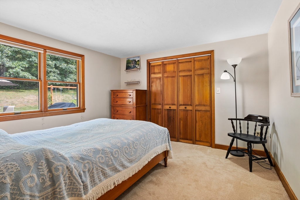 773 Great Road Stow, MA 01775 - Photo 20 of 37 a bedroom with a bed and a window