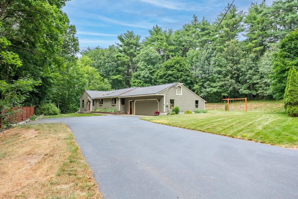 773 Great Road Stow, MA 01775 - Photo 2 of 37 front view of a house with a yard