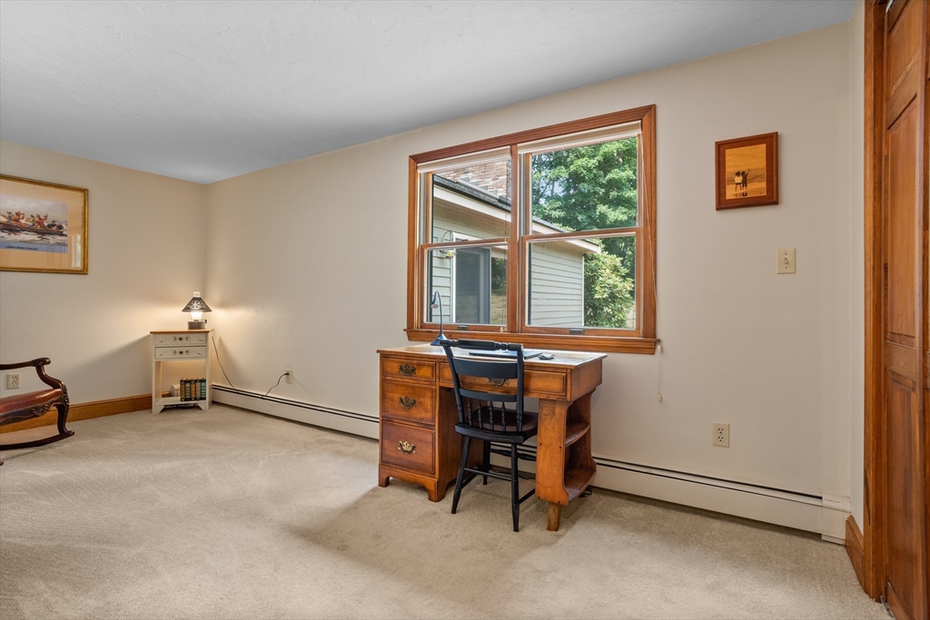 773 Great Road Stow, MA 01775 - Photo 22 of 37 a view of a workspace with furniture and a window