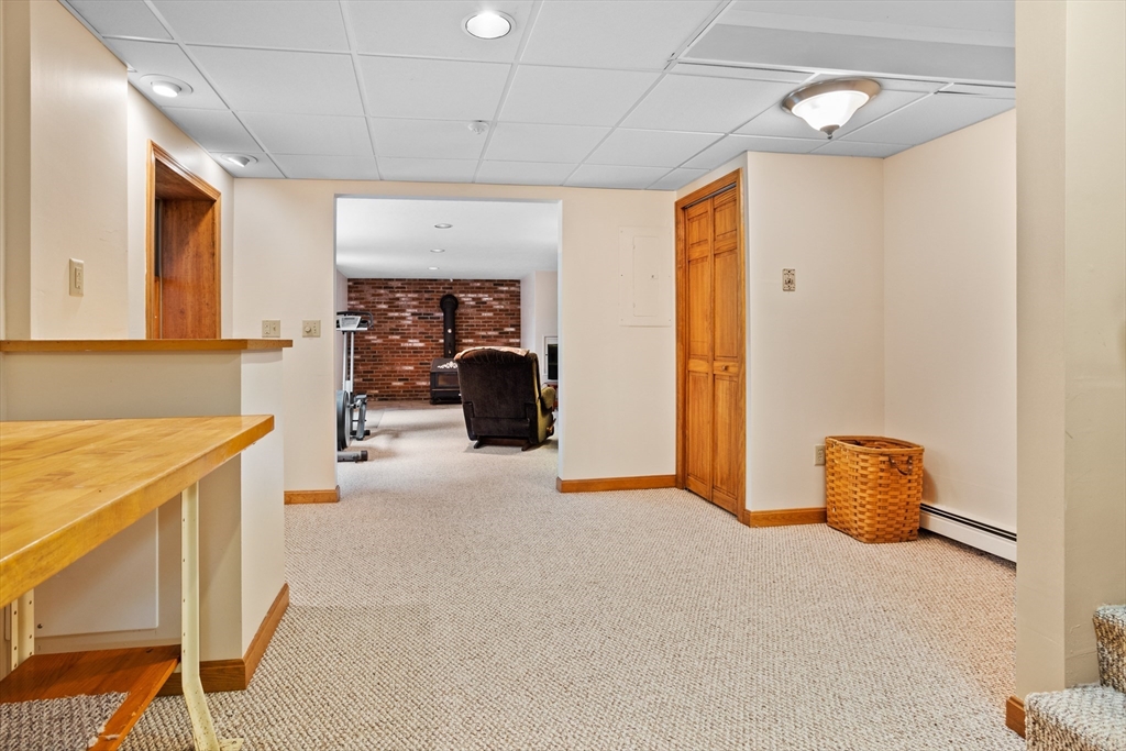 773 Great Road Stow, MA 01775 - Photo 23 of 37 a view of a livingroom with furniture and a ceiling fan