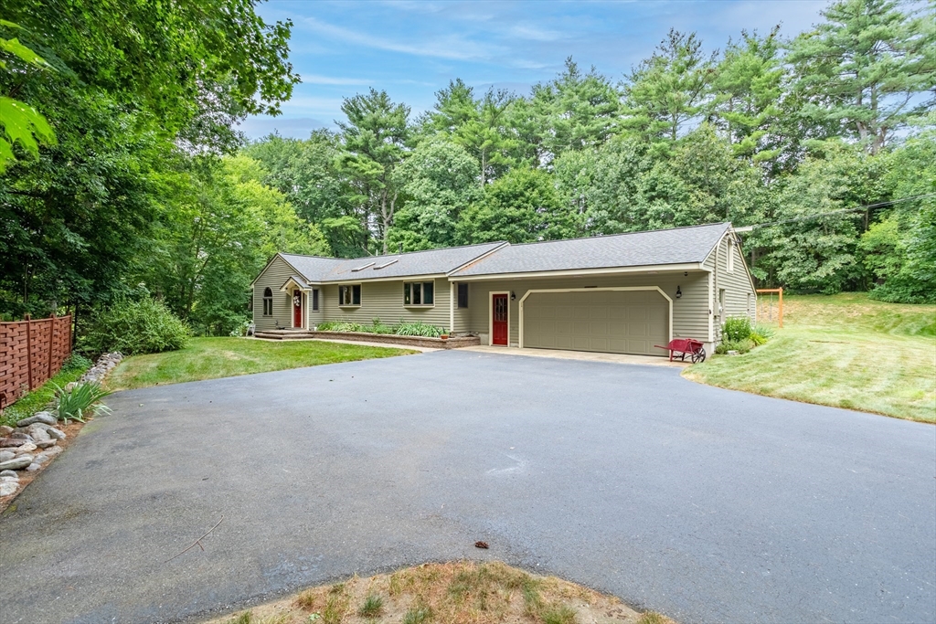 773 Great Road Stow, MA 01775 - Photo 34 of 37 front view of a house with a yard