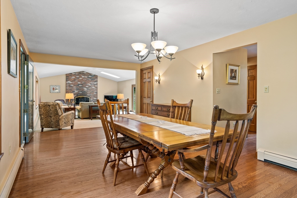 773 Great Road Stow, MA 01775 - Photo 10 of 37 a view of a dining room with furniture wooden floor and chandelier