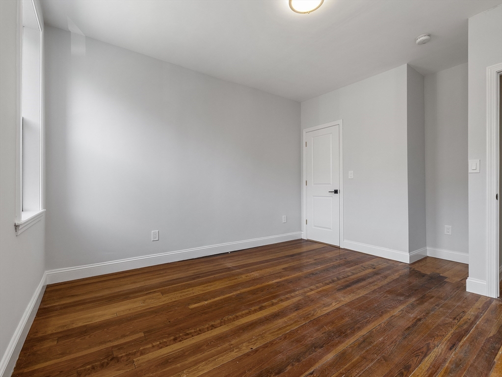 131 A Cottage Street, Unit 2A Boston, MA 02128 - Photo 11 of 16 a view of room with wooden floor