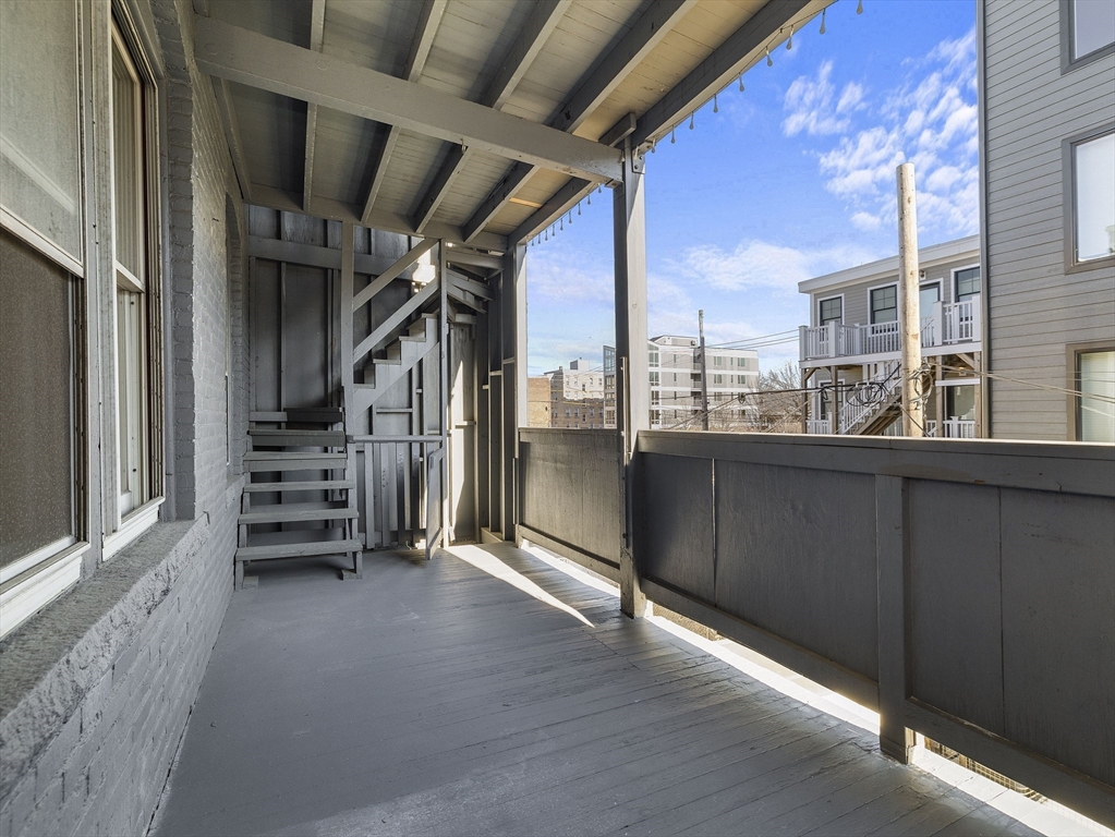 131 A Cottage Street, Unit 2A Boston, MA 02128 - Photo 15 of 16 a view of outdoor space and deck