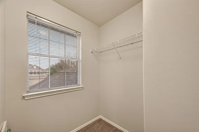 a view of a room that has a window in it